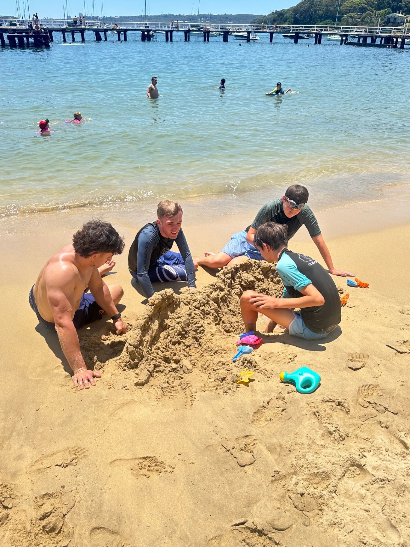 With George participants building sandcastles at the beach