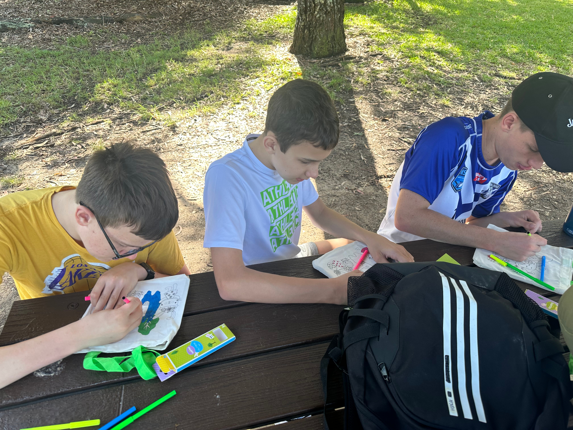 With George participants decorating tote bags at a Sydney park